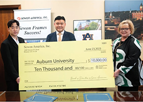 Sewon Group Inc. leaders present a check for $10,000 to Hope Stockton, assistant vice
president for outreach and professional and continuing education, to initiate funding for
the development of training programs
